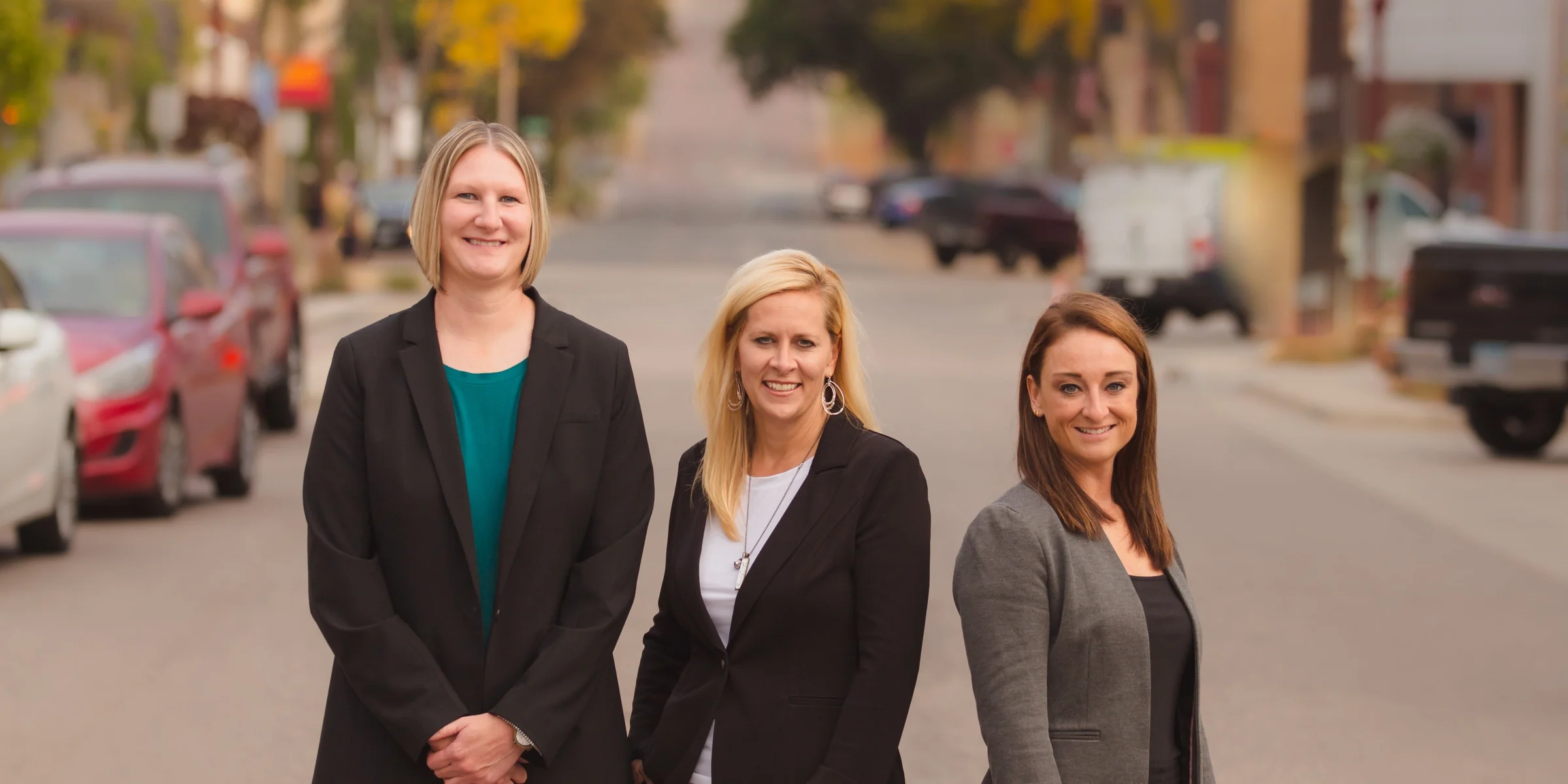 The Premier Title Services team standing together outdoors